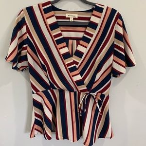 Monteau stripped cap sleeve faux wrap blouse.